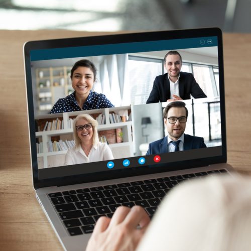 Computer screen view diverse businesspeople negotiating distantly using videocall