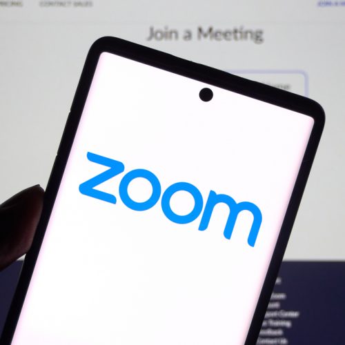 Zoom Communications app and logo on screen.