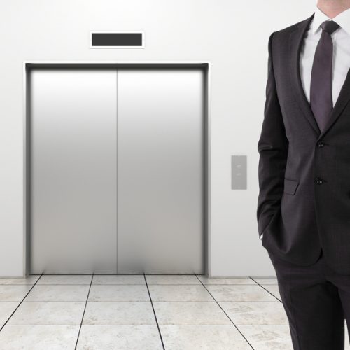 businessman and modern elevator